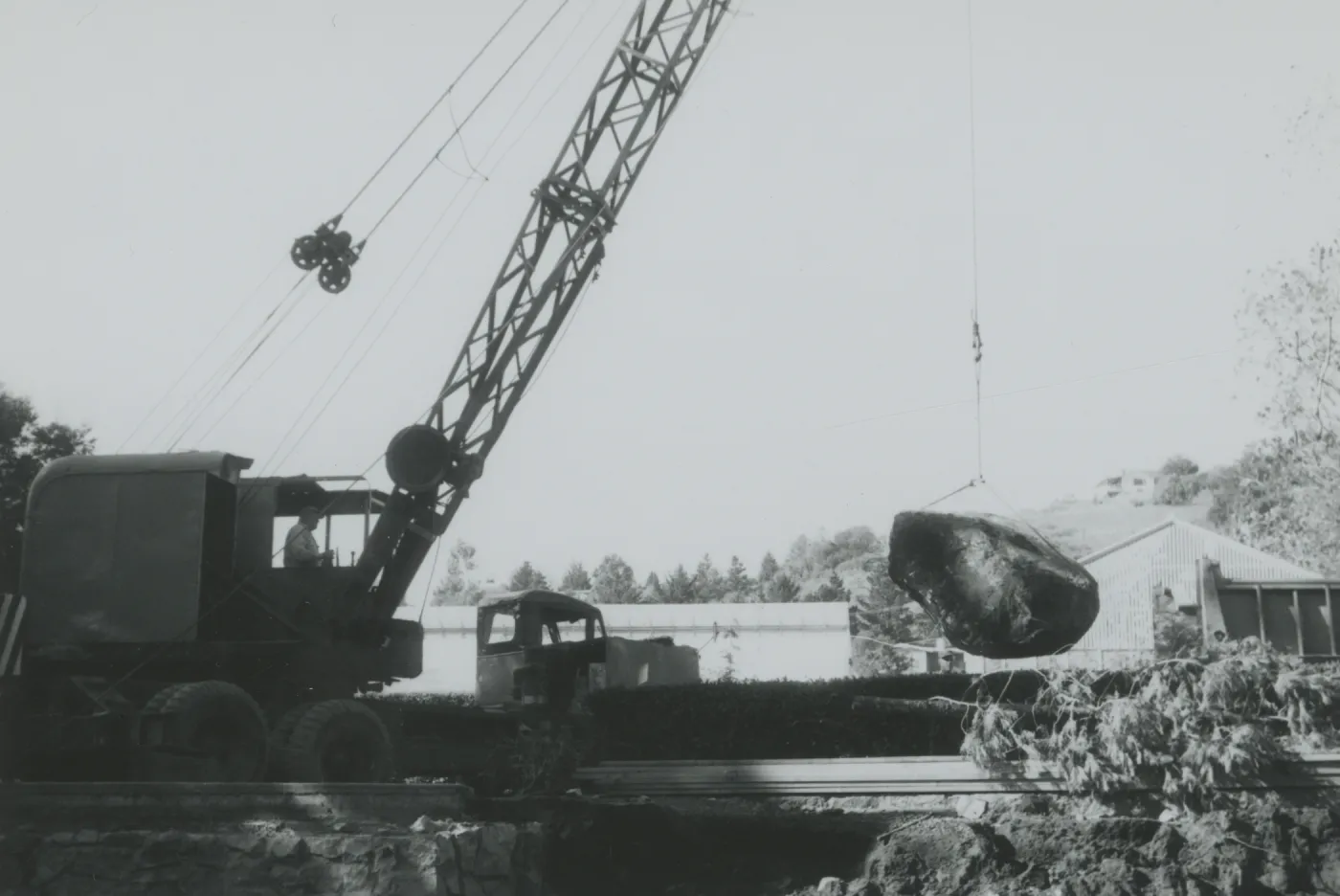 North Wing construction, crane moving boulders