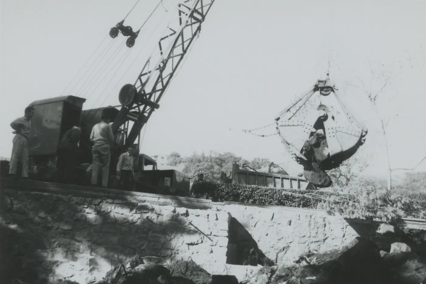 North Wing construction, crane moving boulders