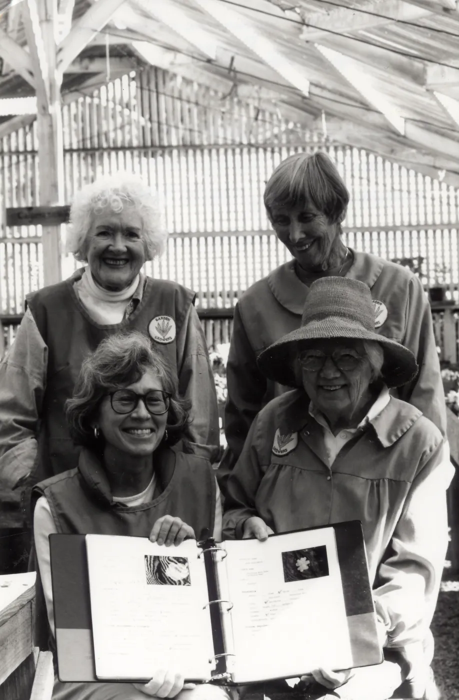 Volunteers - Garden Growers Clockwise from upper left: Betty Himes, Nathalie Hodge, Stevie Service and Betsy Graham; Displaying their new notebook, Fall, â€˜94 - IQ Spring 1993 Ironwood Quarterly