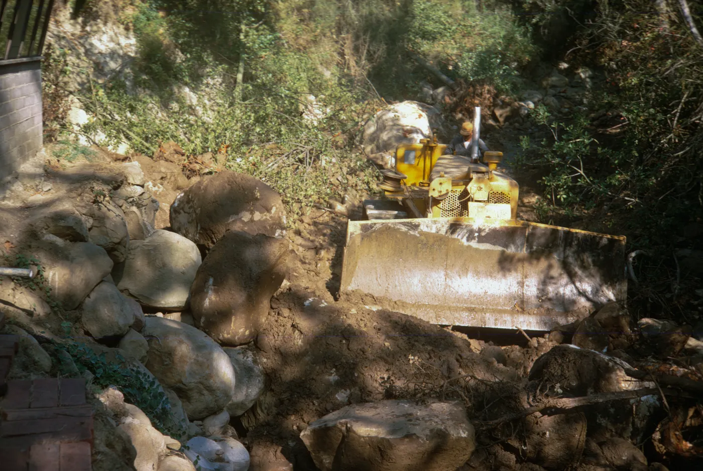 bulldozer repair to bank erosion of Mission Creek below the Guild House