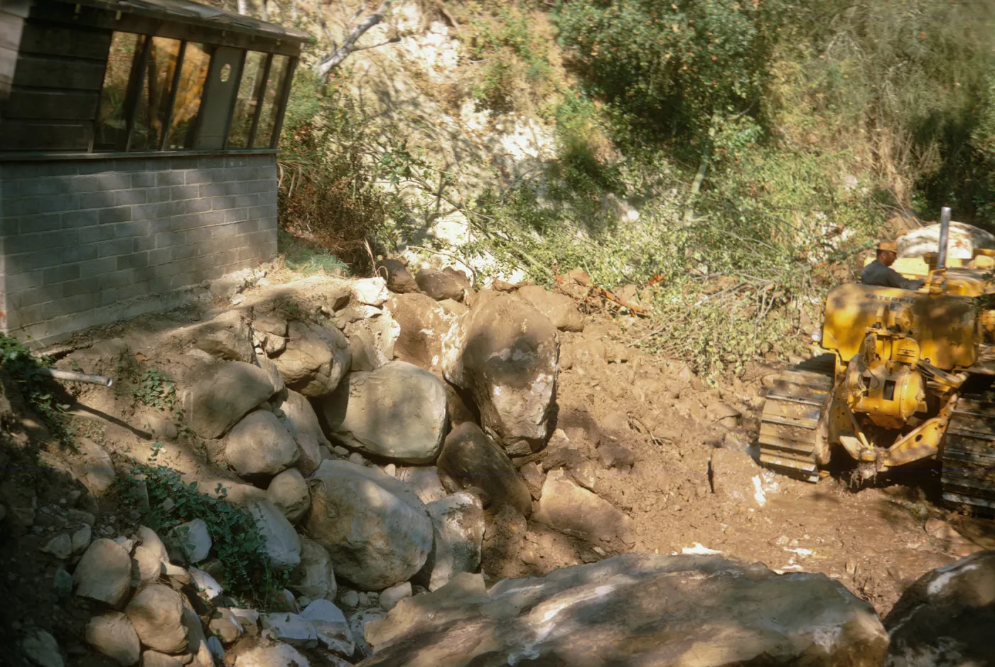 bulldozer repair to bank of Mission Creek below the Guild House