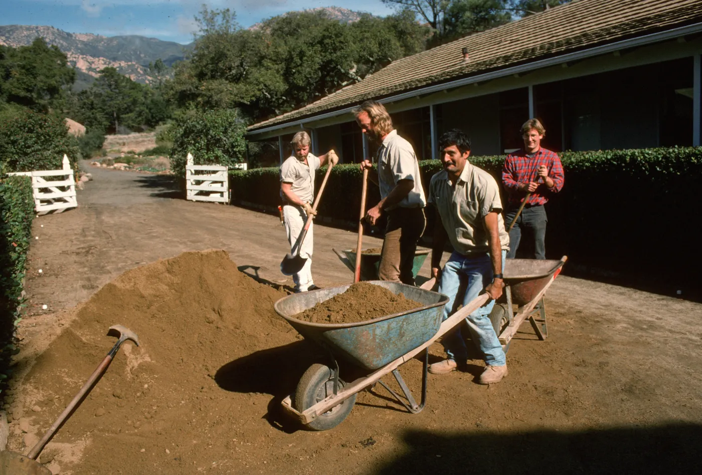 Adding new layer of decomposed granite to courtyard