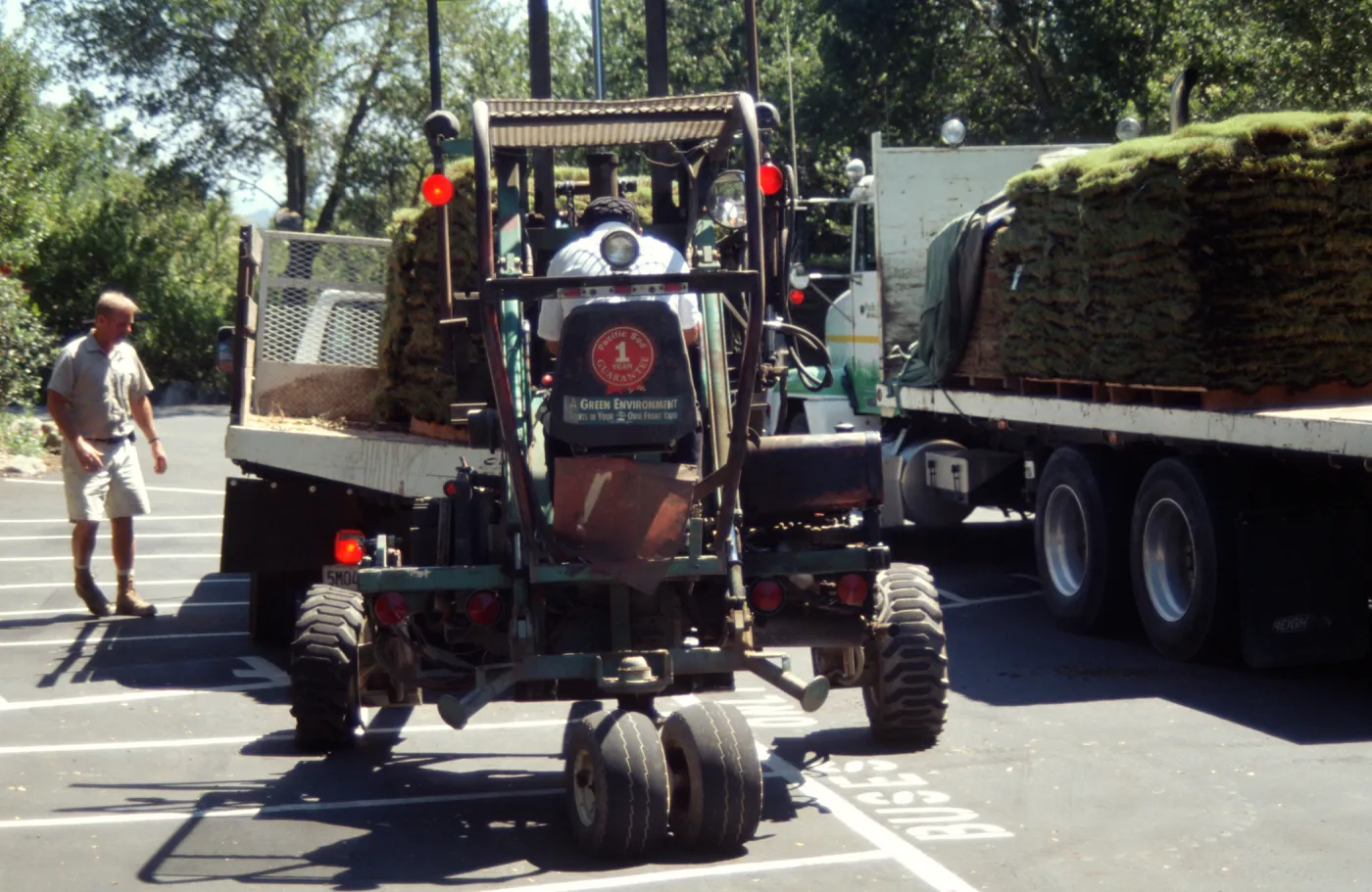 tractor unloading sod for Meadow lawn