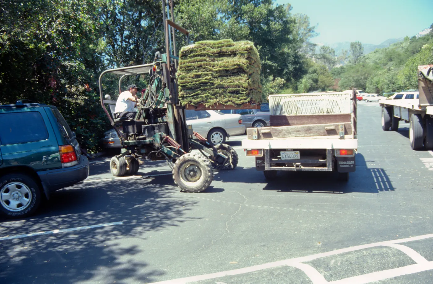 tractor unloading sod for the new Meadow lawn Installation