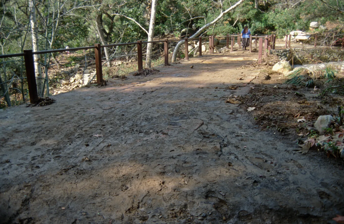Mud covering the top of Mission Dam