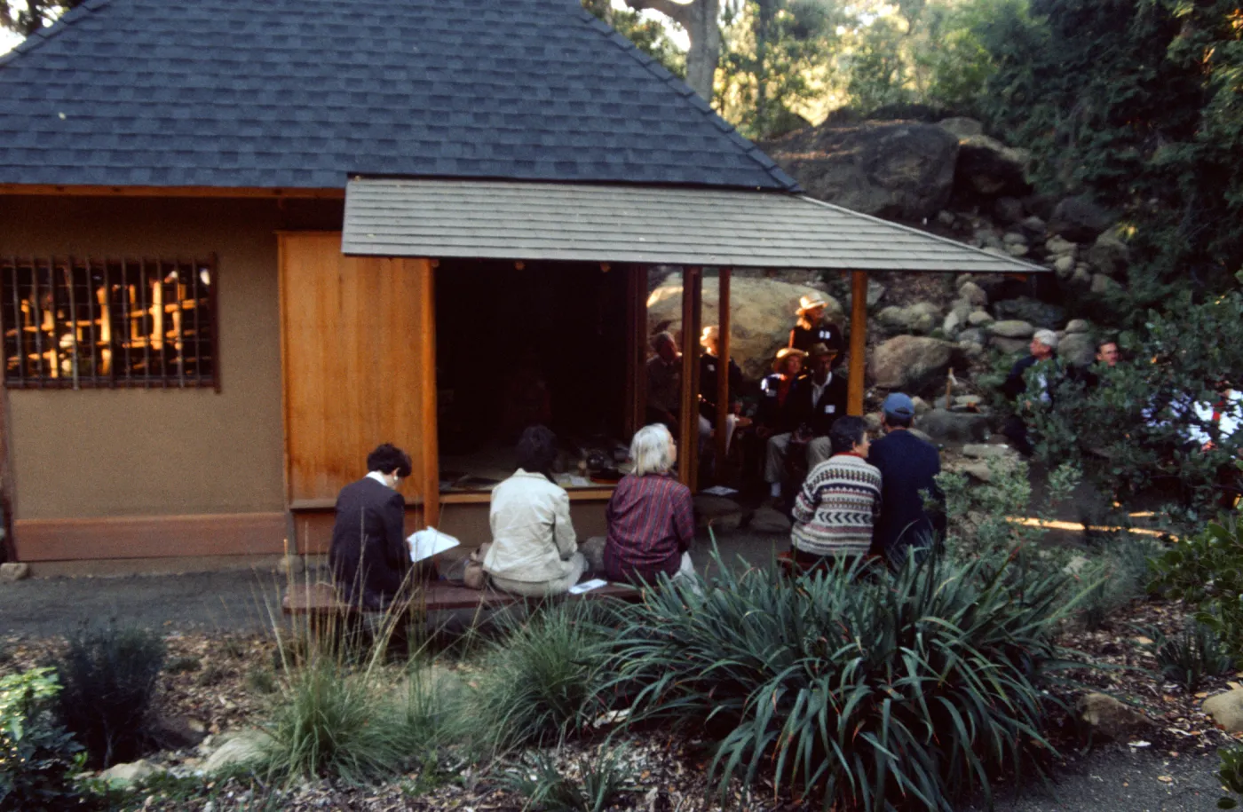 people surrounding tea house at event