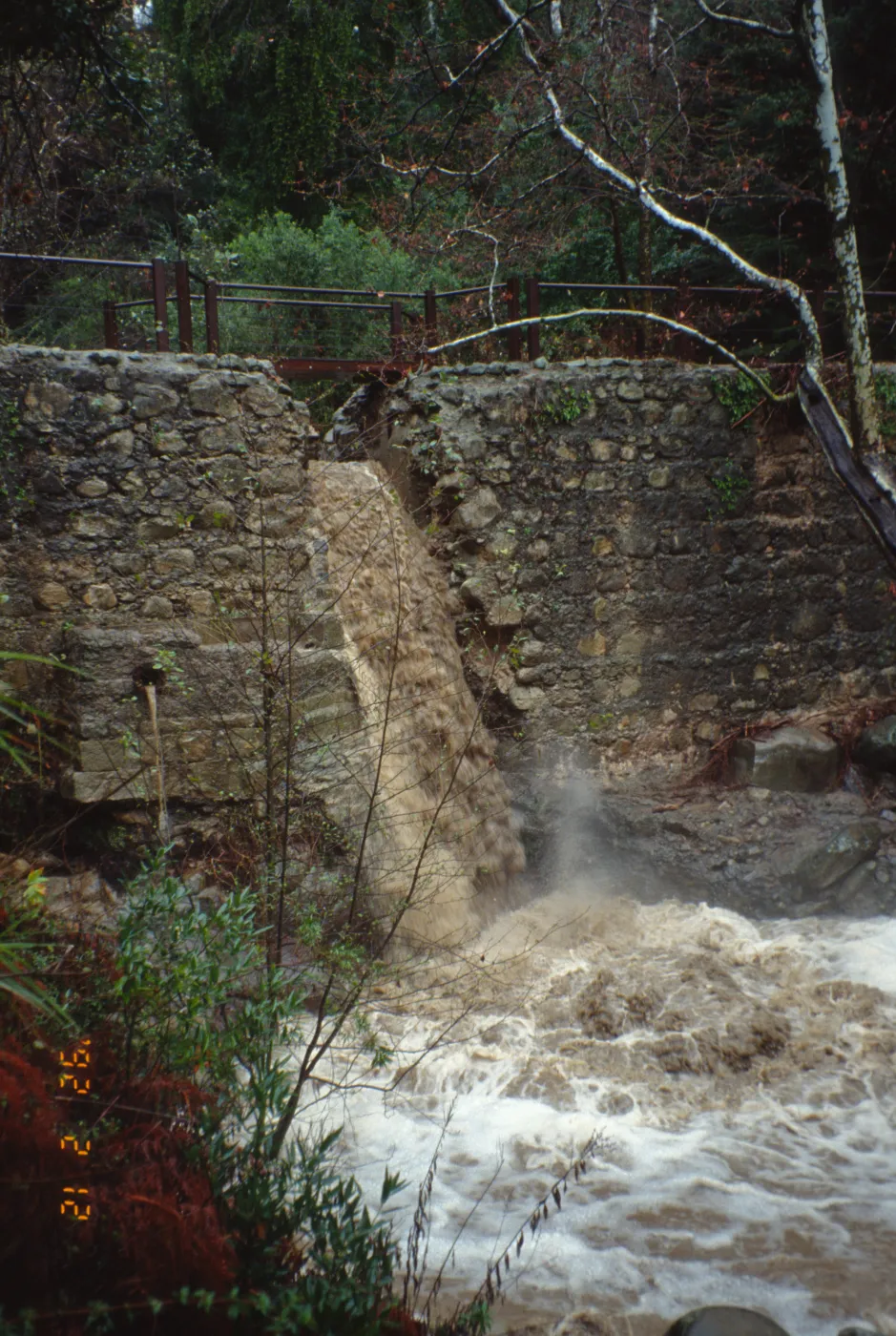 Mission Creek flooding through Mission Dam