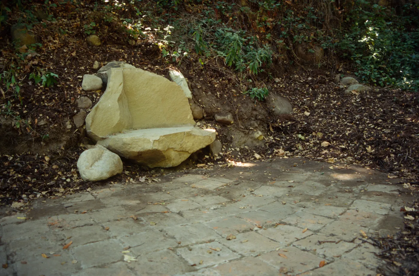 new stone bench on west side of Mission Dam, exposed tiles