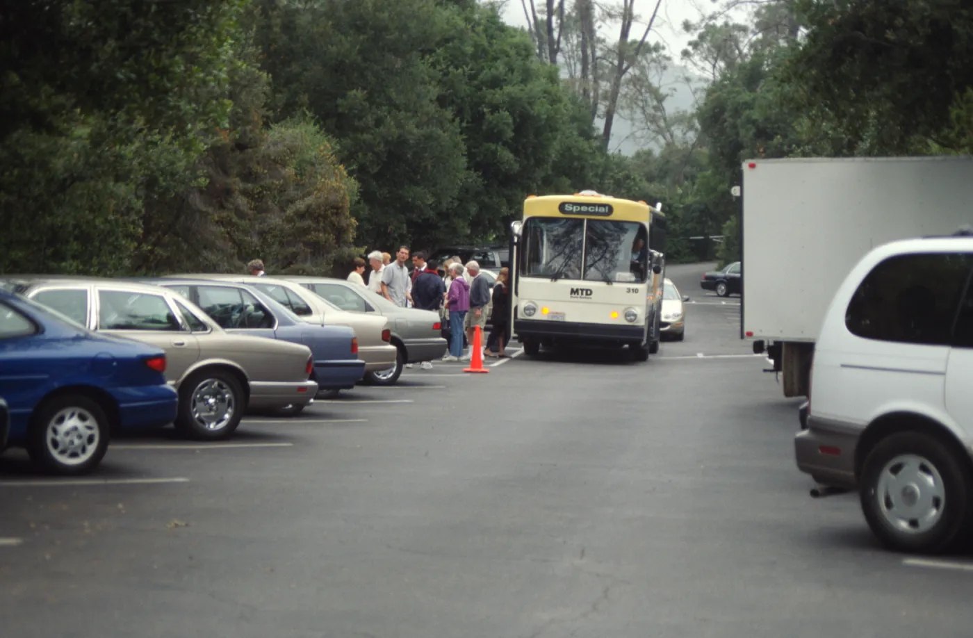 75th Anniversary City Bus Unloading in parking lot