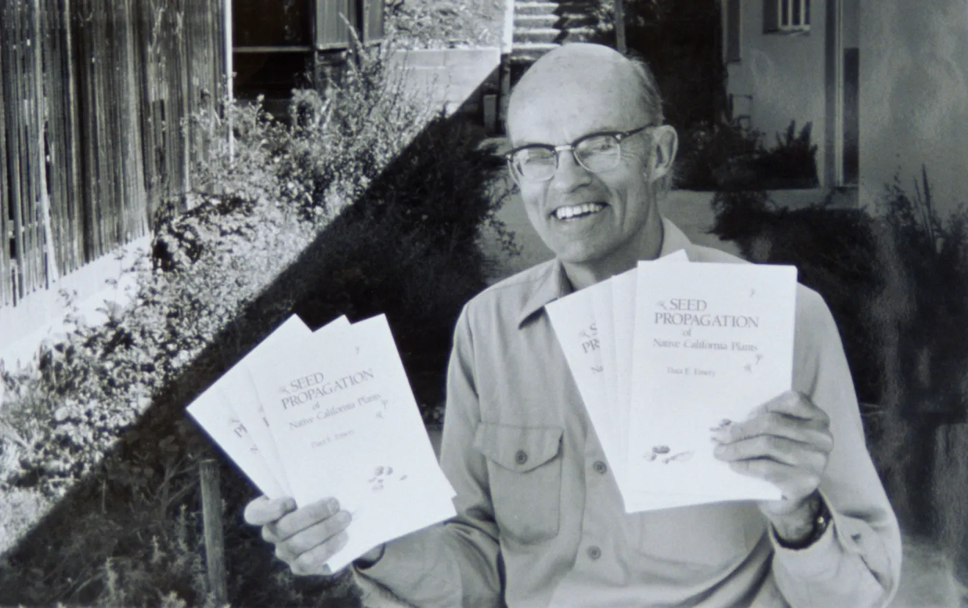 Dara Emery with copies of 'Seed Propagation of Native California Plants'