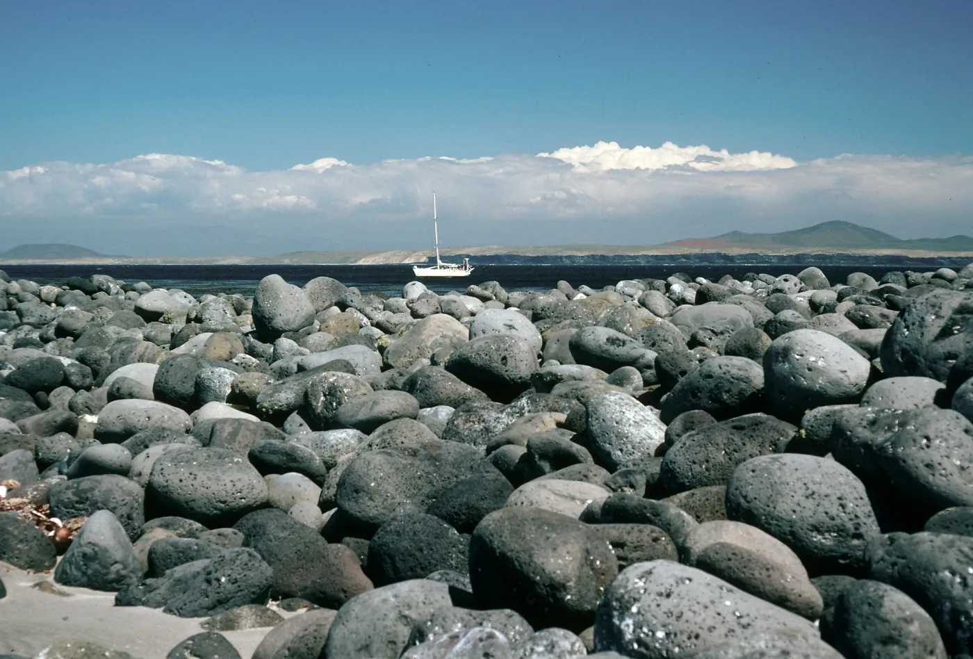 San Martin Island, rock spit, powered sailboat Diamaresa