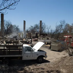 firefighters and firetruck at the Gane House site, after the Jesusita Fire