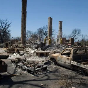 firefighters put out a hot spot at the Gane House site, after the Jesusita Fire
