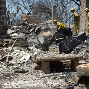 Firefighters put out a hot spot at the Gane House site, after the Jesusita Fire