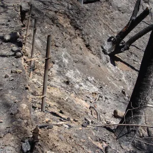 Pritchett Trail slope, burned remains of retaining wall, after the Jesusita Fire