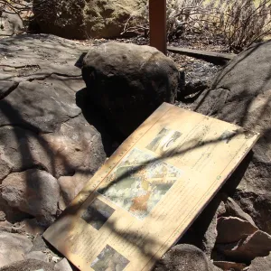 burned 'Hardscape Design' sign and debris from the Home Demonstration Deck, after the Jesusita Fire