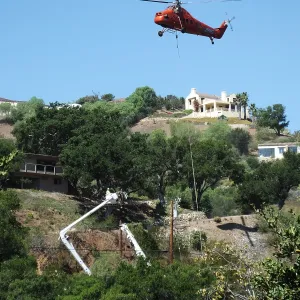 Sikorsky S-58T Screaming Mimi helicopter replacing utility pole in west Mission Canyon