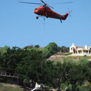 Sikorsky S-58T Screaming Mimi helicopter replacing utility pole in west Mission Canyon
