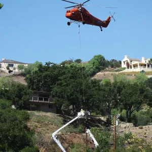 Sikorsky S-58T Screaming Mimi helicopter replacing utility pole in west Mission Canyon