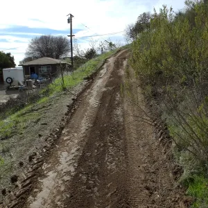Road grading at Cavelli property to control soil erosion into neighboring property