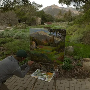 Plein Air artist Chris Potter signs painting of Meadow