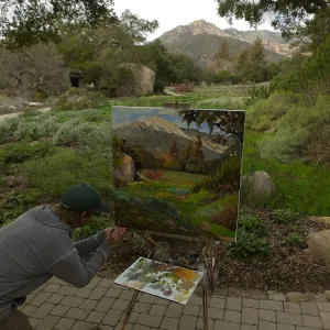 Plein Air artist Chris Potter signs painting of Meadow