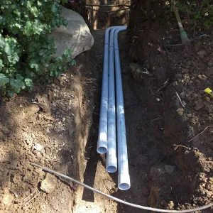 Power and data conduit being installed in the Arroyo Section
