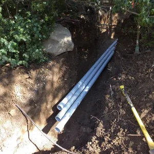 Power and data conduit being installed in the Arroyo Section