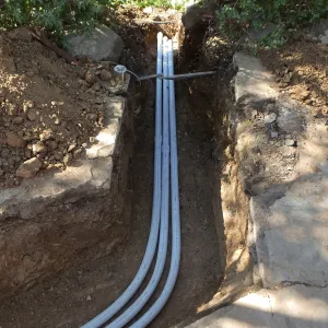 Power and data conduit being installed in the Arroyo Section