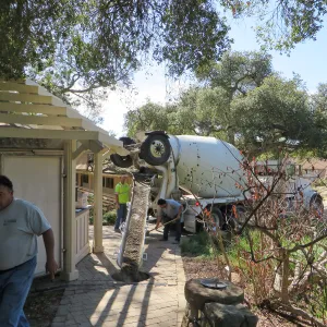 Filling septic tank at entrance with cement slurry