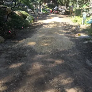 Spreading California gold gravel in Arroyo