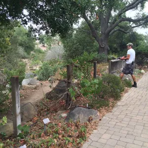 Adam Kuster removing fence at the Home Demo Garden