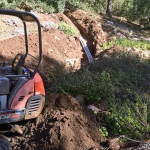 Power and data conduit being installed in the Arroyo Section
