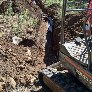 Power and data conduit being installed in the Arroyo Section