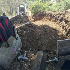 Construction of drainage culvert southeast corner of upper parking lot.