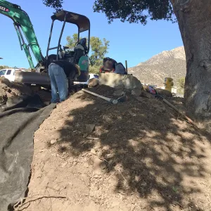 Construction of drainage culvert southeast corner of upper parking lot.