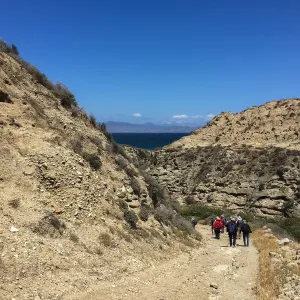 Santa Rosa Island Trip, Group hiking along Coastal Road looking towards airstrip and Santa Cruz Island