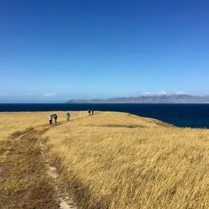 Santa Rosa Island Trip, group hiking along bluff looking out towards Santa Cruz Island