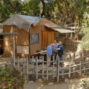 Linda Mathews, Chair of the Teahouse Improvements Fundraising Committee, gives Steve Windhager donations totaling $8,000 from the tea house volunteers to launch the fundraising for the repairs and improvements of the Teahouse and Tea Garden in 2017-2018