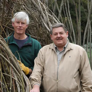 Patrick Dougherty and Ed Schneider during construction of Toad Hall