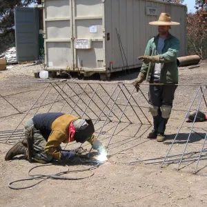 Construction of Herb Parker's â€˜Haven' labyrinth, welding roof framework