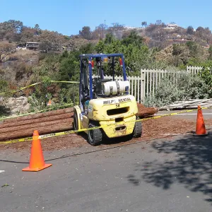 Construction of Herb Parker's â€˜Haven' labyrinth, redwood logs from Restoration Forest Project in main parking lot