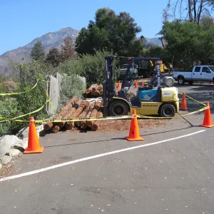 Construction of Herb Parker's â€˜Haven' labyrinth, redwood logs from Restoration Forest Project in main parking lot
