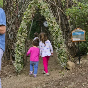 Santa Barbara Botanic Garden Casitas Opening, children playing in the â€œWoodrat Houseâ€ Casita