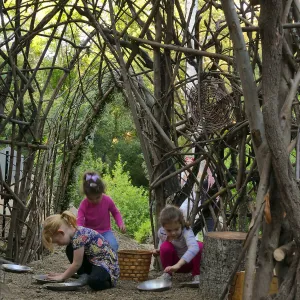 Santa Barbara Botanic Garden Casitas Opening, children playing in the â€œWoodrat Houseâ€ Casita