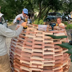 Volunteers building â€˜The Hives' casitas