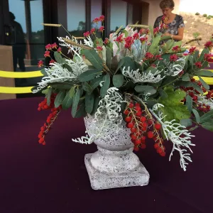 Flower arrangement with toyon berries