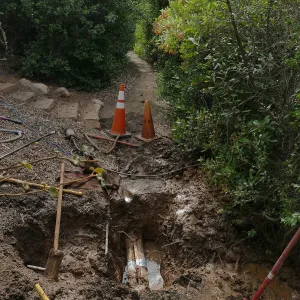 Broken 4 inch irrigation water pipe in Porter Trail section, looking south