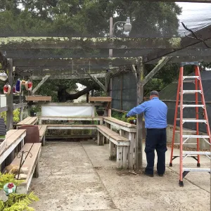 Repair of Garden Growers shade structure, looking south