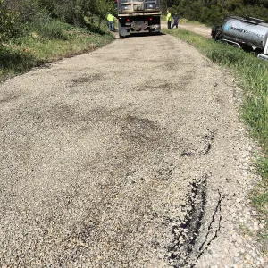 Chip sealing service road on East Slope of Garden